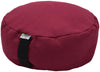 Red meditation cushion with a brand label on a white background