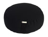 Black meditation cushion with a brand label on a white background