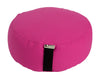 Pink meditation cushion with a black strap on a white background