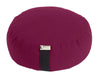Round meditation pillow with a brand tag on a white background