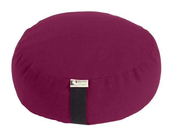 Round meditation pillow with a brand tag on a white background