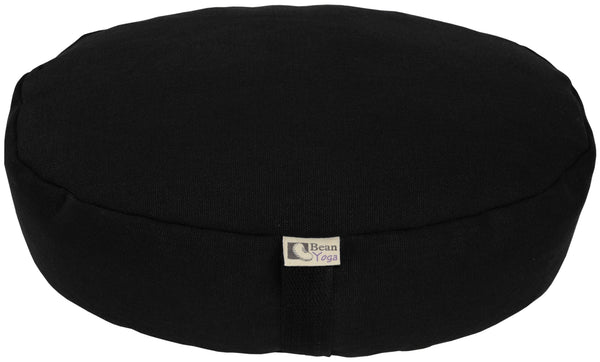 Black meditation cushion with a visible brand label on a white background