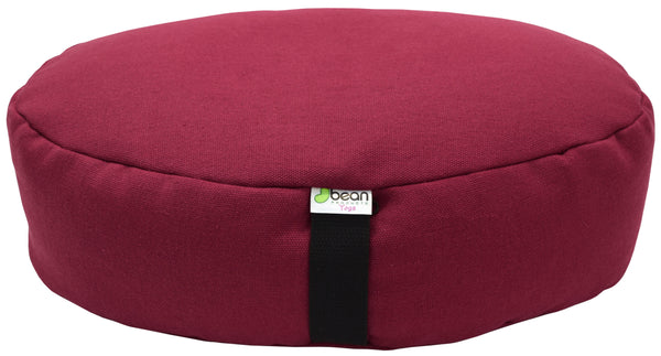 Maroon meditation cushion with a visible brand label on a white background