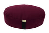 Maroon meditation cushion with a visible brand label on a white background