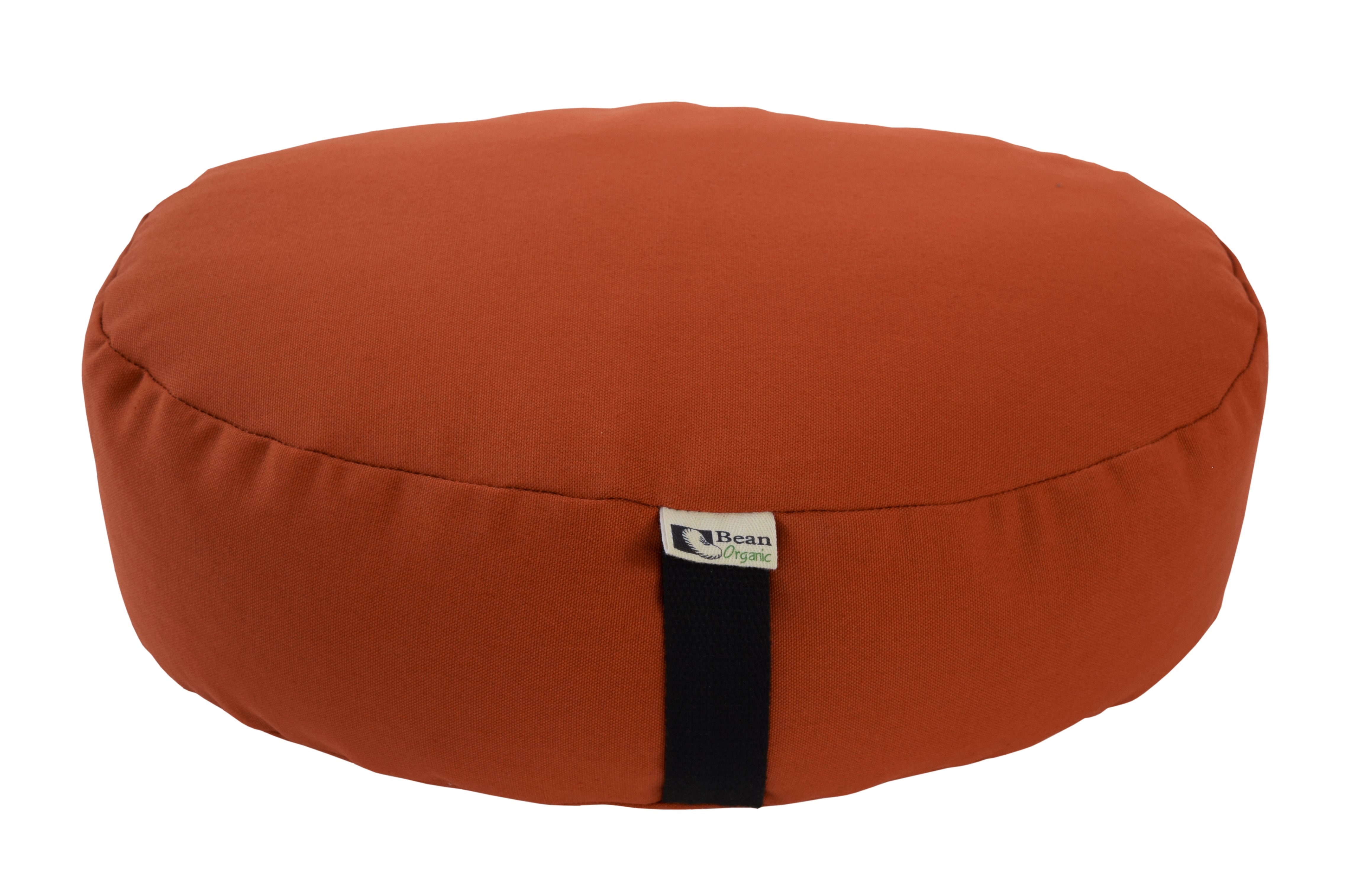 Orange meditation cushion with a black strap on a white background
