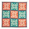Kelsey Weigl Fair Isle furoshiki reusable gift wrap folded flat, showing bold geometric snowflake design in festive colours