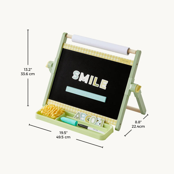 A light green wooden easel-style children's chalkboard with a writing tray, brush, letter tiles, and white roll, shown on a light gray background with dimension lines and text indicating size measurements.