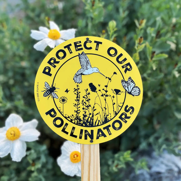 Round 9-inch embossed aluminium garden sign reading Protect Our Pollinators with bee, butterfly, and bird artwork, by Seattle Seed Company