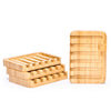 Desesh bamboo self-draining soap dish with bar soap resting on waterfall slatted rack