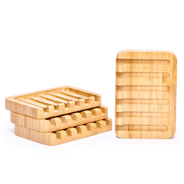 Desesh bamboo self-draining soap dish with bar soap resting on waterfall slatted rack