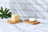 Close-up of bamboo soap dish slatted drainage design on a bathroom countertop