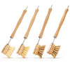 Desesh long handle wood and metal dish brush with natural fiber bristles on a clean surface