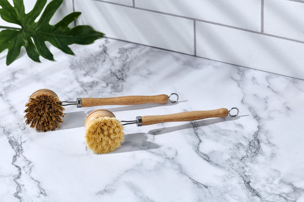 Close-up of Desesh 9-inch wooden dish brush showing coconut fiber bristles and metal ferrule