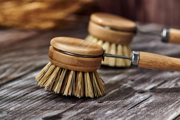 Desesh wood and metal dish brush displayed showing plastic-free eco-friendly packaging