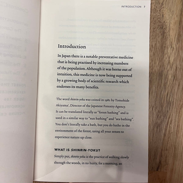 Open book on a wooden surface with visible text