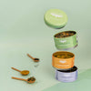 JusTea Assorted Trio tea gift set displayed with stackable tins and artisan spoons — perfect eco-friendly gift