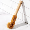 Close-up of coconut fiber bristle head on Desesh eco-friendly bottle cleaning brush