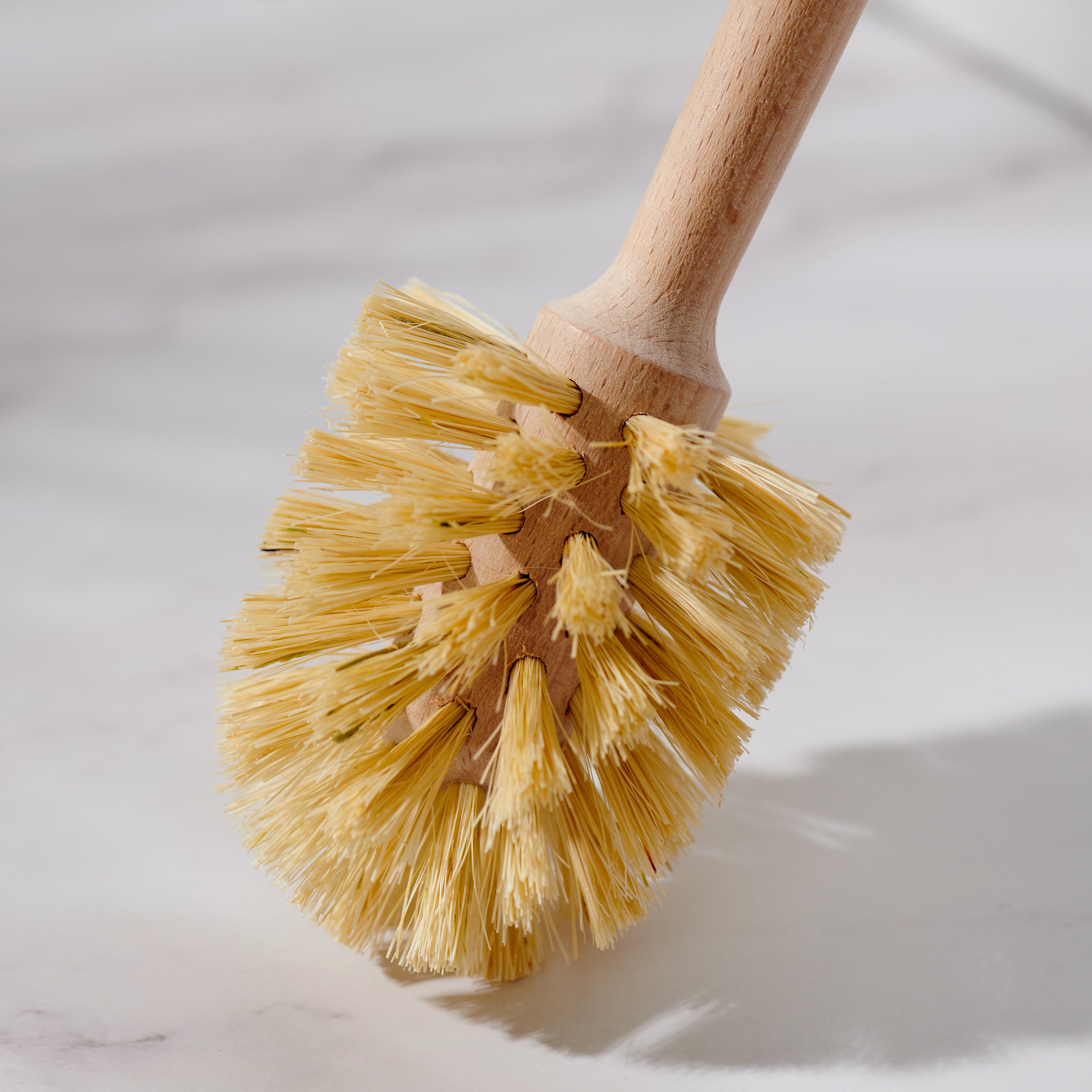 Desesh bamboo toilet brush with long handle displayed in a bathroom setting with natural home decor
