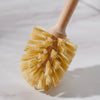 Desesh bamboo toilet brush with long handle displayed in a bathroom setting with natural home decor