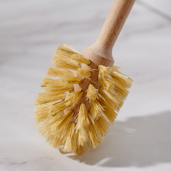 Desesh bamboo toilet brush with long handle displayed in a bathroom setting with natural home decor