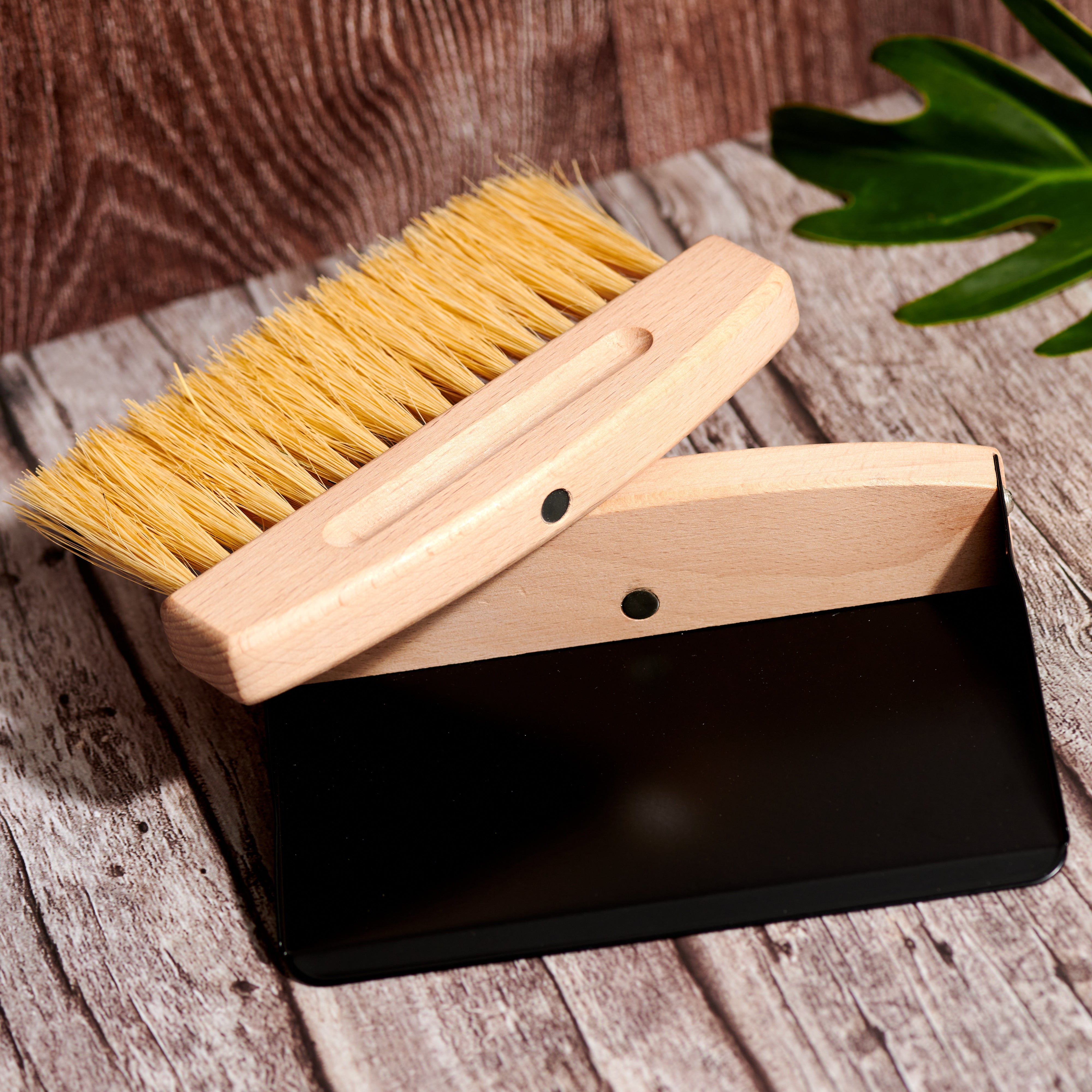 Desesh mini broom and black dustpan set displayed together showing magnetic connection