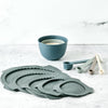 Bamboozle mixing bowl lids and measuring tool bundle laid out on a kitchen surface