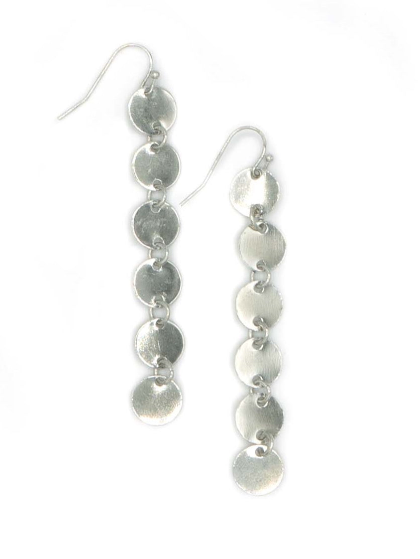Silver disc earrings on a white background