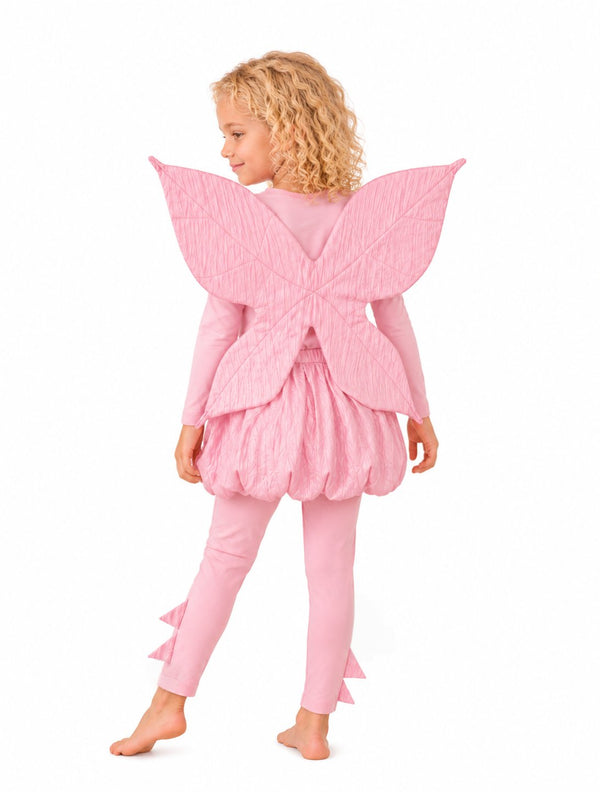 Detail view of leaf-inspired stitching on pink fairy wings