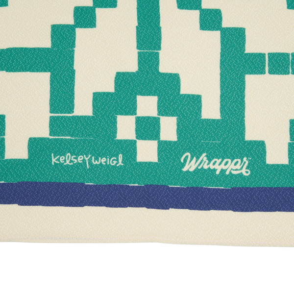 Textile product with geometric pattern and 'kelseyweigl' and 'Wrappi' branding.