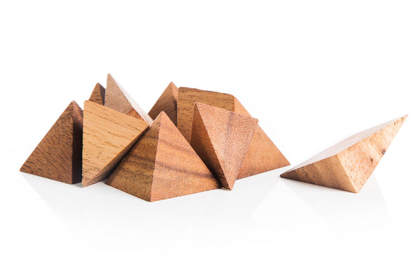 Wooden pyramid-shaped objects on a white background