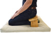 Person using Bean Products zabuton meditation base cushion during a seated meditation session