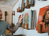 Person selecting a vinyl record from a wall-mounted hardwood Flip Record Display Shelf