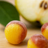 Close-up of Andy Anand pear drop hard candy showing natural pear flavour and individually wrapped packaging