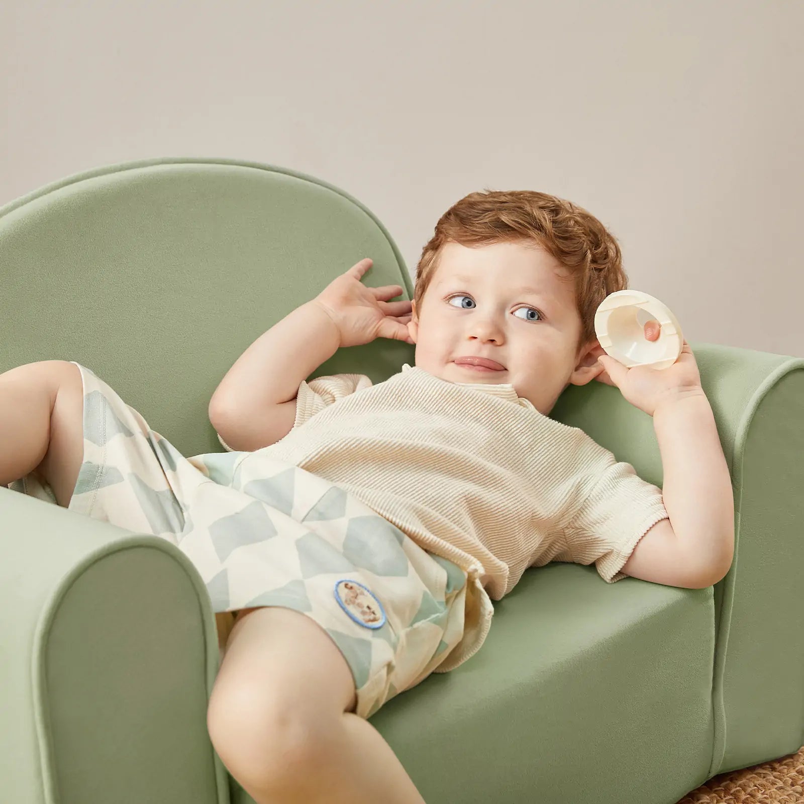 Tiny Land GentleSnug kid chair unfolded flat as a toddler nap bed in sage