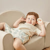 Tiny Land kids sofa chair unfolded flat into a children's lounge bed in beige white