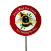 Garden sign with a bee illustration and text 'Don't Mind the Weeds Just Feeding the Bees' on a white background.