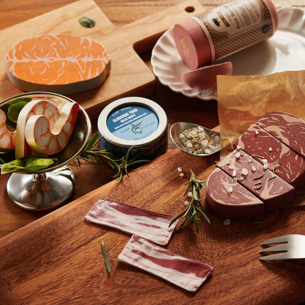 Hand-painted wooden play food pieces including bacon, sausage and tuna in tray-style packaging