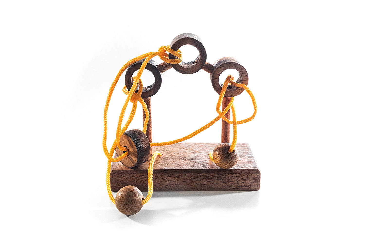 3 Posts wooden disentanglement puzzle with strings and posts on a desk