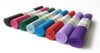 Set of colorful yoga mats rolled up on a white background