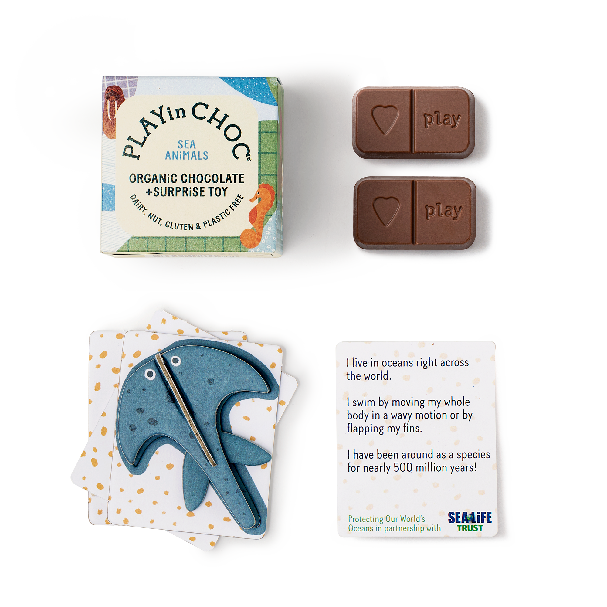 Play'n Choc organic chocolate and surprise toy packaging with a dolphin-shaped toy and educational card.