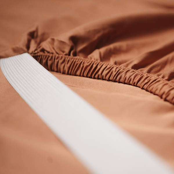 Close-up of brown fabric with a white stripe