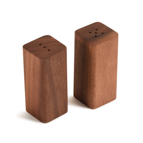 Pair of wooden salt and pepper shakers on a white background