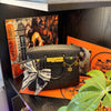 Close-up of the Onali Pure Black Large Iconic scented bag candle, showing sculptural handbag design in deep black finish