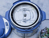 Ecozoi stainless steel insert pan set stacked showing two tiers inside a pressure cooker