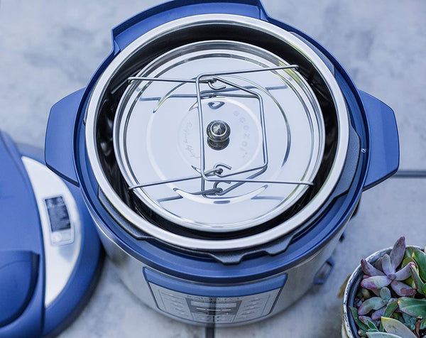 Ecozoi stainless steel insert pan set stacked showing two tiers inside a pressure cooker