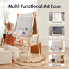 Child using a multi-functional art easel with various surfaces