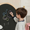 Magnetic whiteboard side of the Tiny Land arched easel with alphabet and number magnets