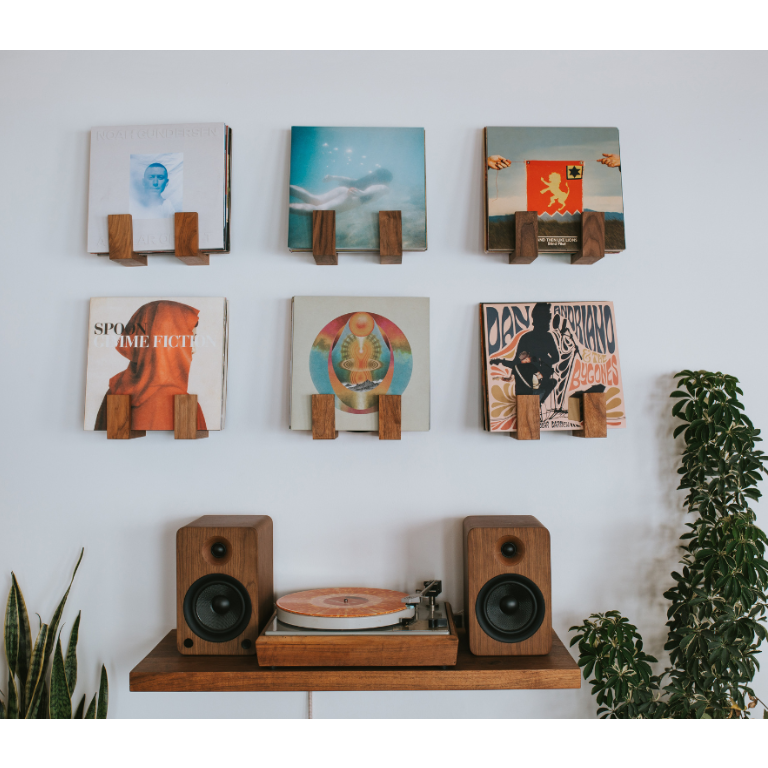 Flip Record Display Shelf in walnut mounted on a wall above a turntable and speakers