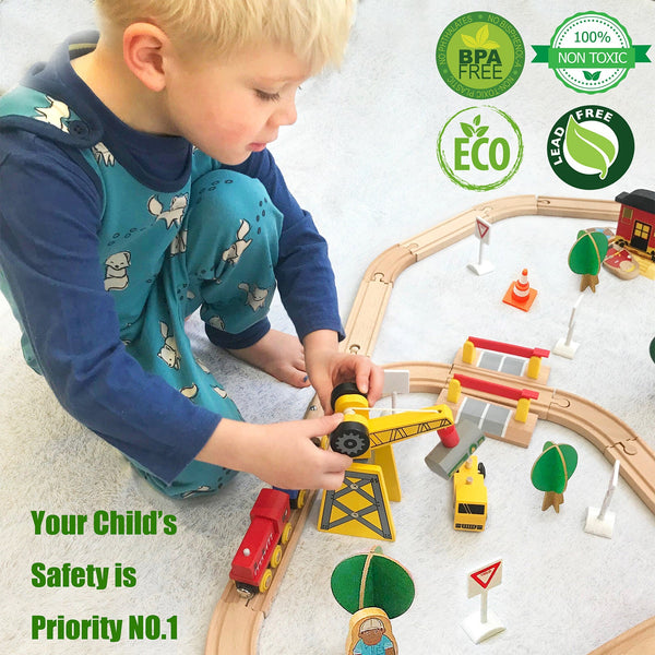 Child playing with a wooden train set on a light-colored floor, with safety and eco-friendly certification logos displayed.