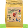 Bag of Flawn Seed Feather Backyard Birder's Blend bird food with a cardinal and other birds on the label.